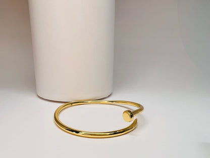 bangle in shape of nail in gold