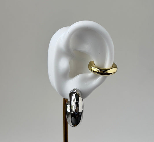 Silver chunky hook earrings for women in a mock up ear