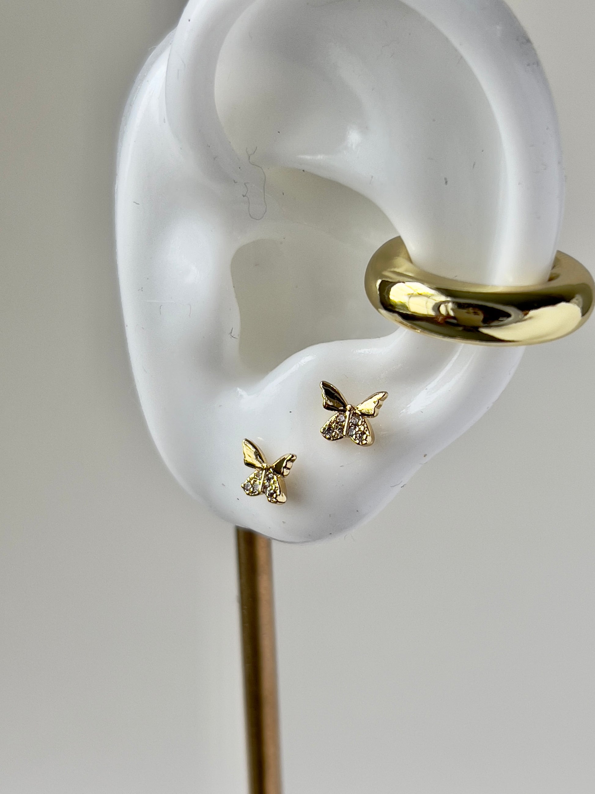 butterfly shape small stud earrings in gold and cubic zirconia details