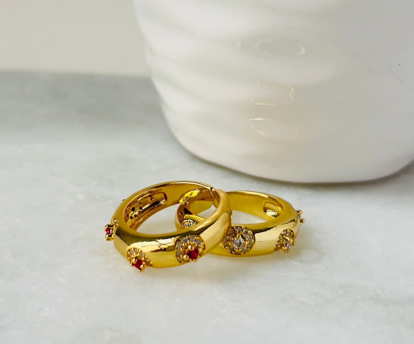 Two prima muse rings in red and silver