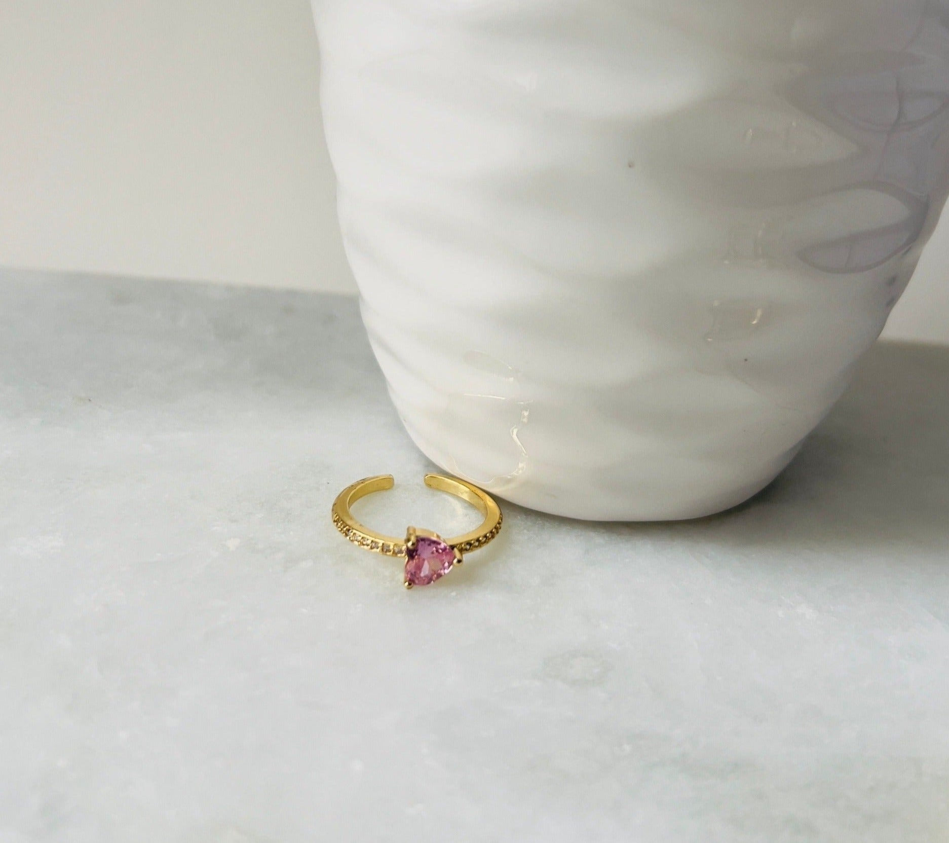 gold ring engagement style with pink heart in zirconia