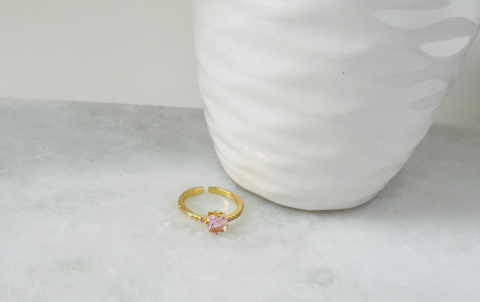 Small gold crystal ring adds a touch of glamour and elegance to any ensemble