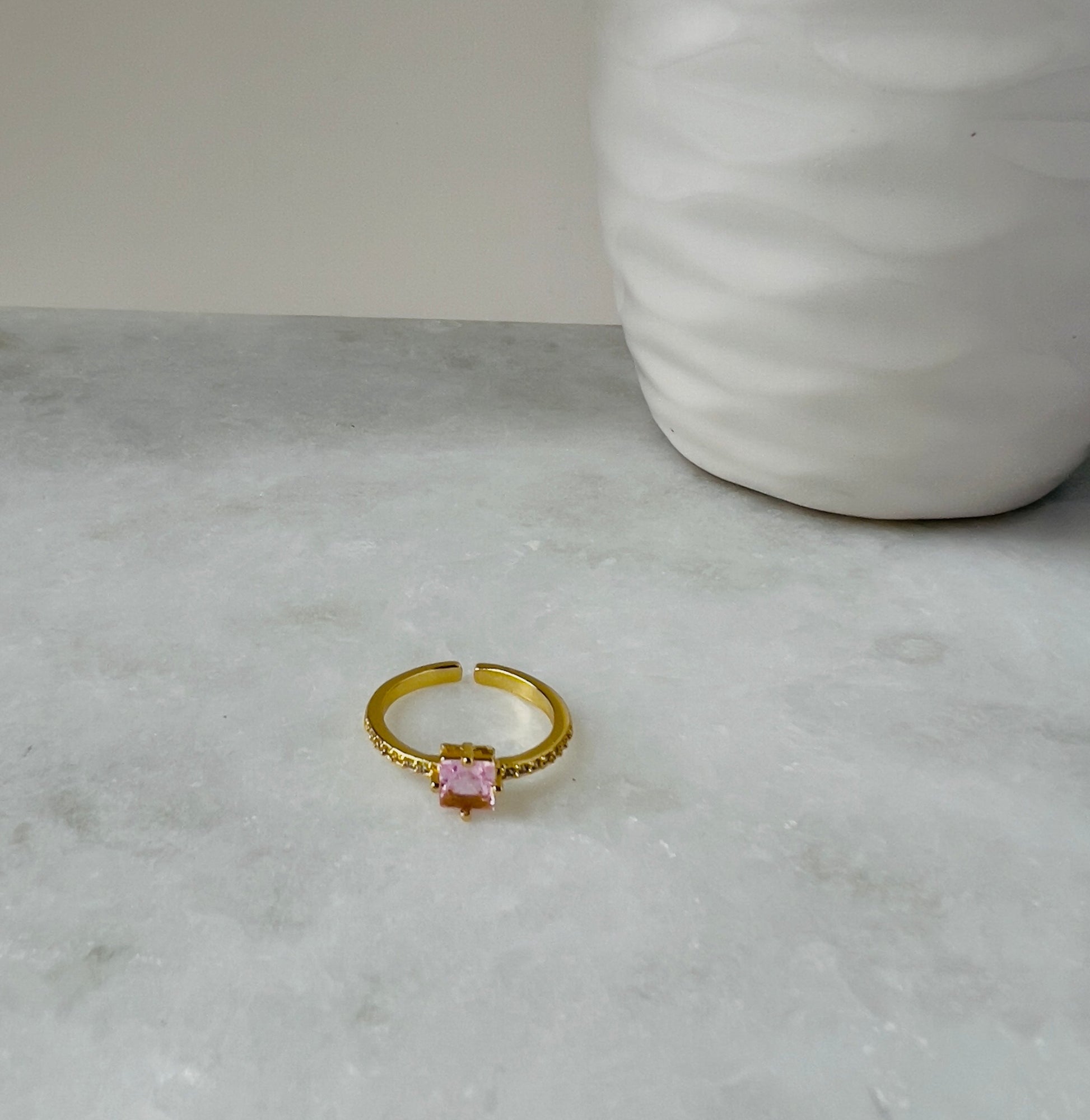 Elegant crystal ring set in luxurious gold, showcasing a sparkling clear gemstone that radiates brilliance and sophistication. Perfect for special occasions or as a timeless gift, this gold crystal ring adds a touch of glamour and elegance to any ensemble