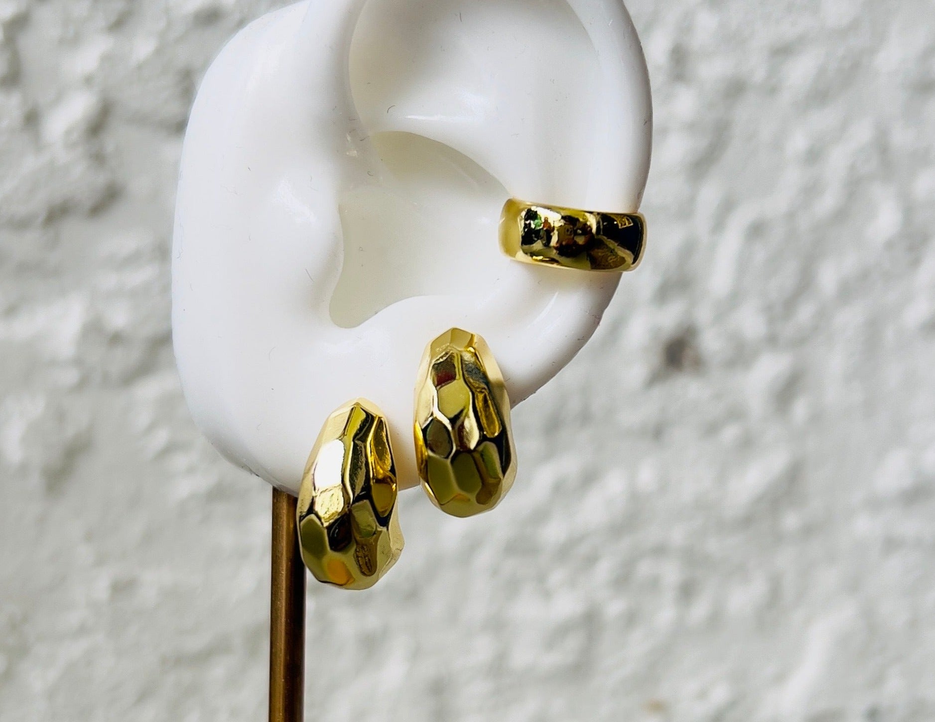 mila ear cuff displayed in a mock up ear