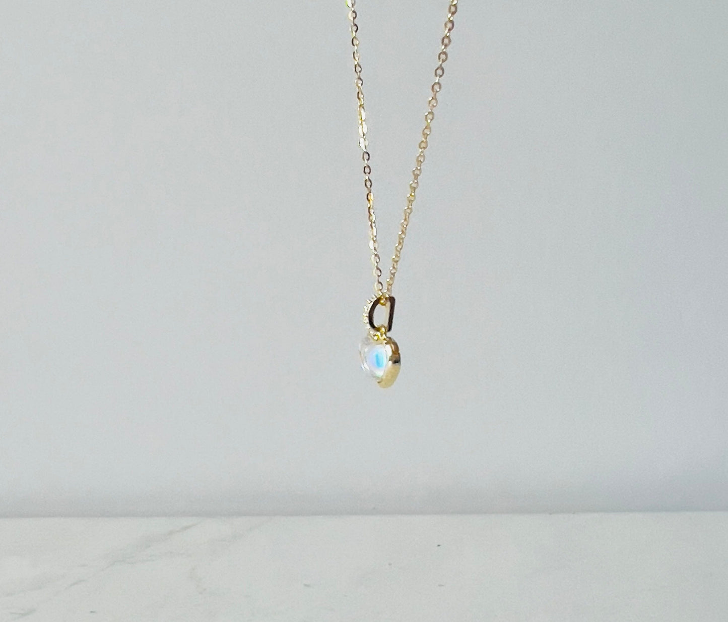 set with pendant necklace and moon shaped earrings in gold and silver details, perfect for moon lovers