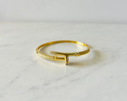 sophisticated nail shaped gold bangle