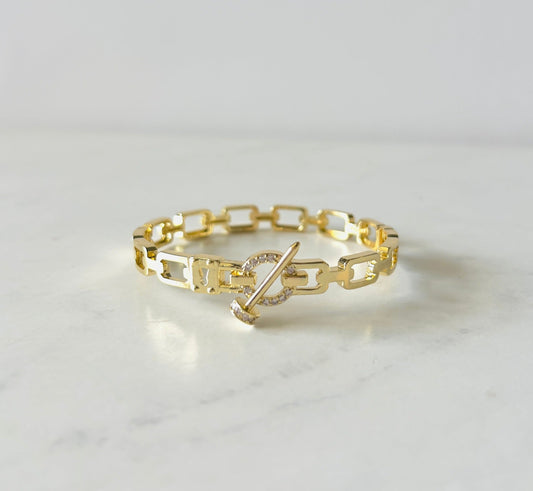 gold bangle bracelet with paperclip style and zirconia details