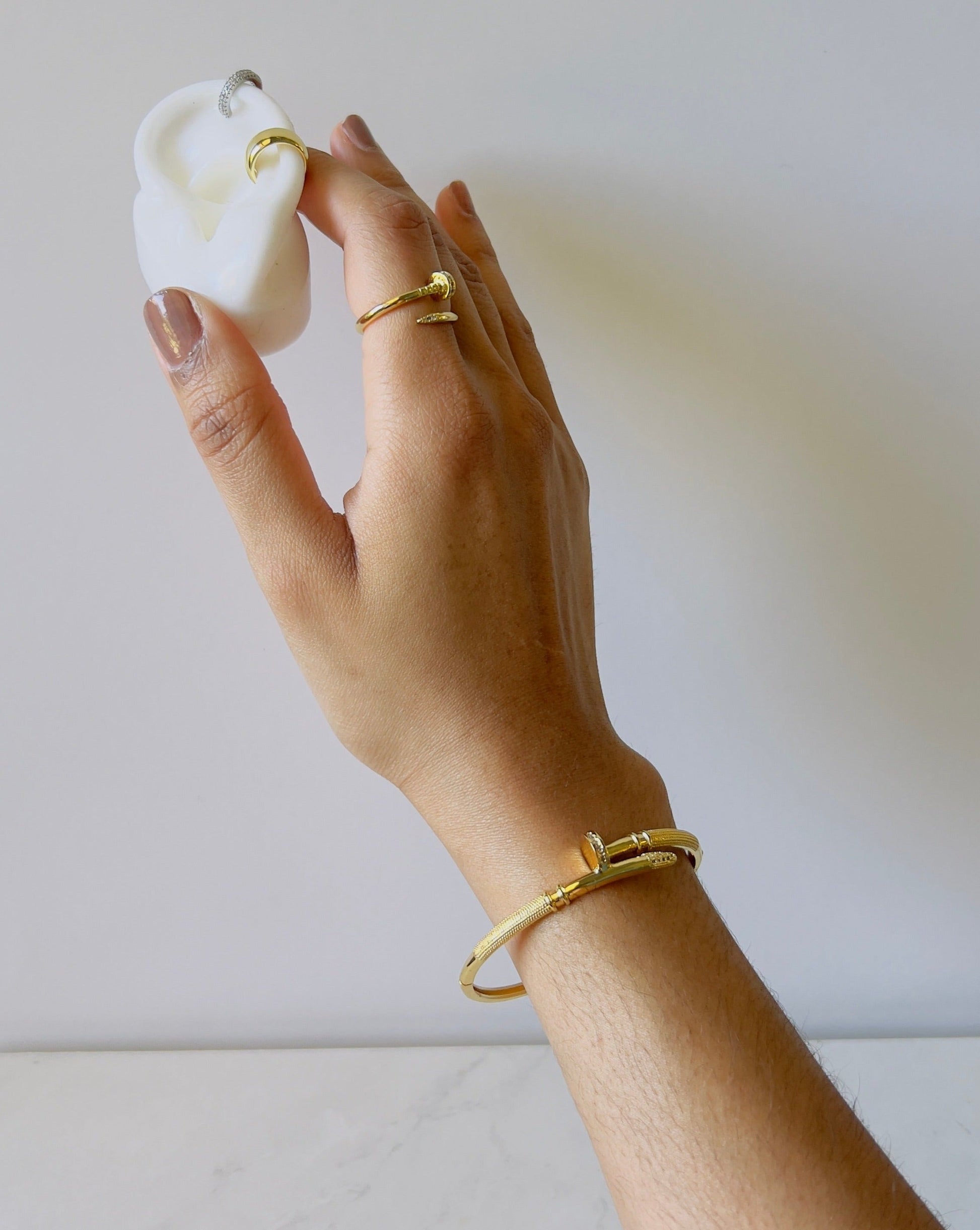 nail shaped bangle with matching ring in gold