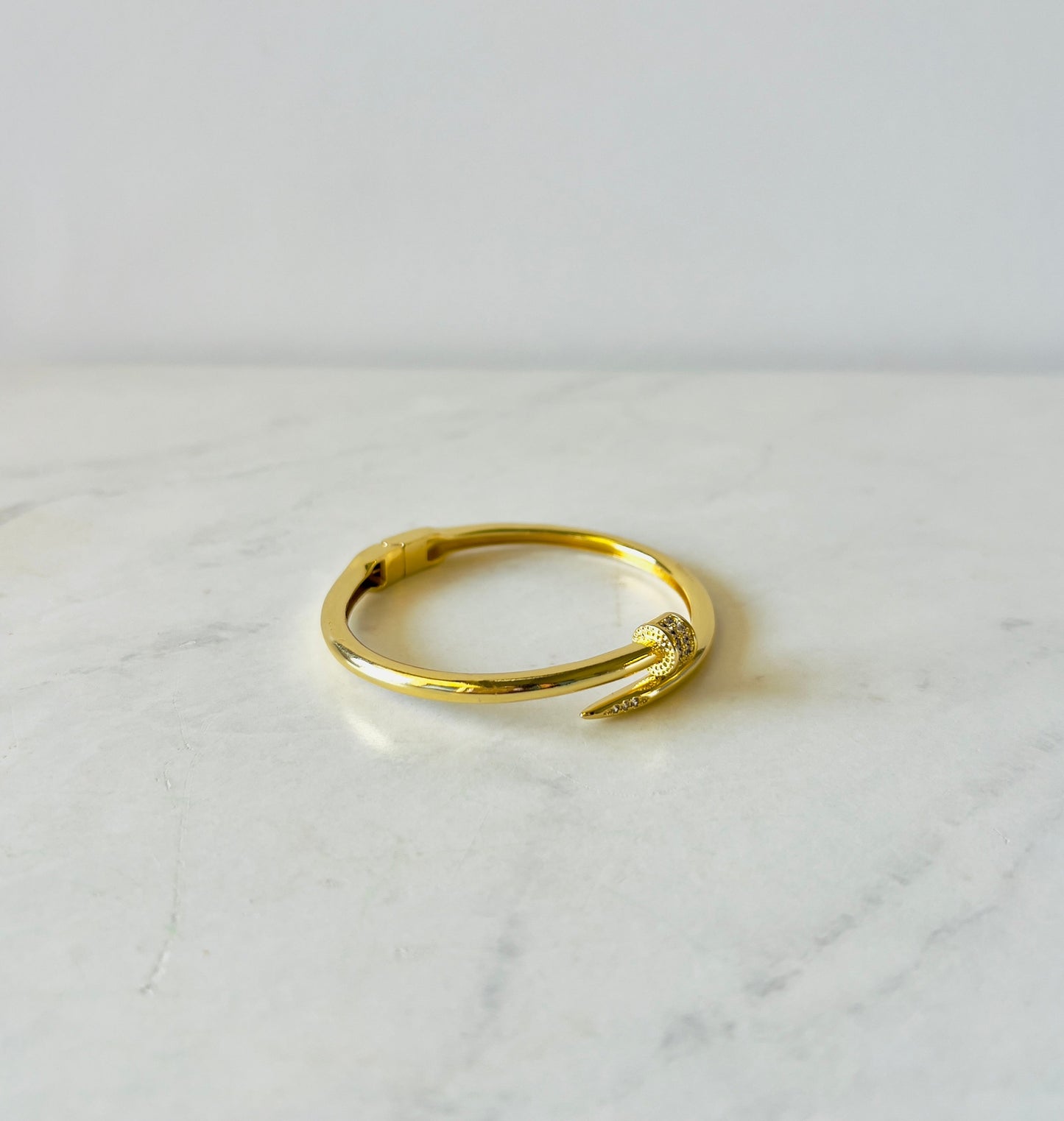 Cocobrillo's nail shaped bangle in gold