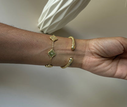 royal bangle in gold in a woman's wrist