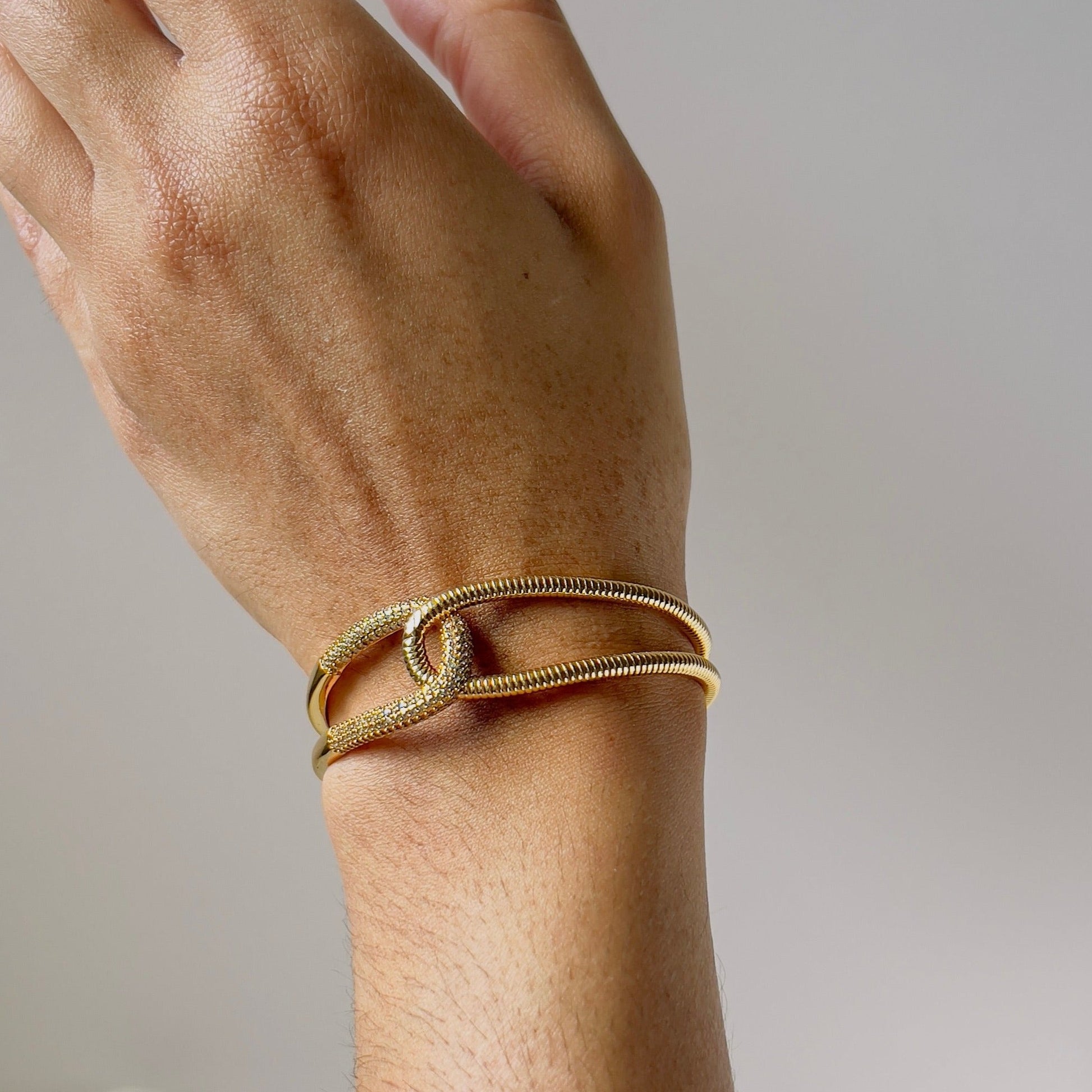 wide bangle bracelet in gold for elegant dress