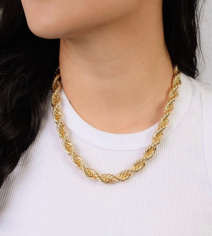 Chunky twisted choker in gold for women in a woman's neck