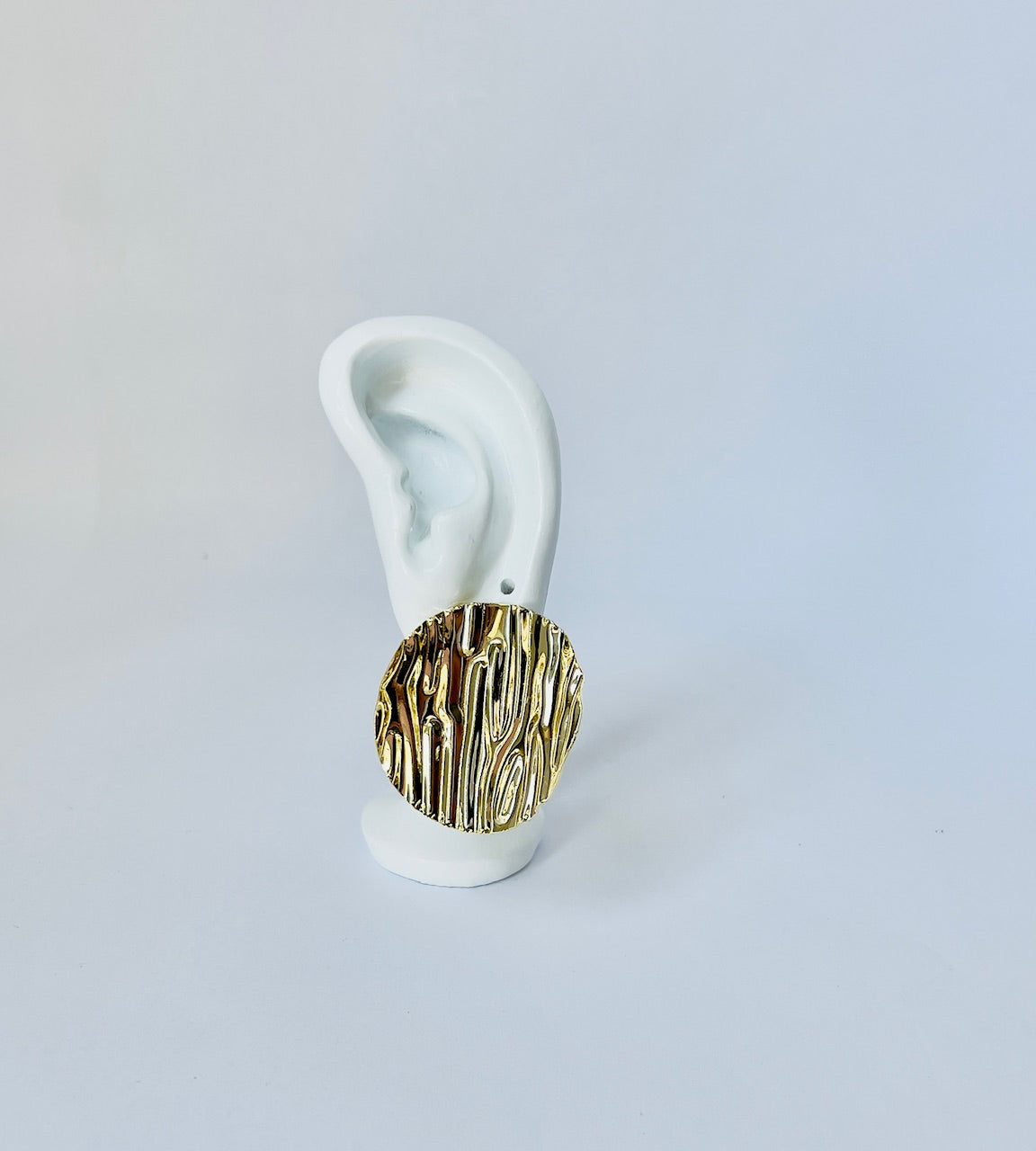 Exquisitely crafted, these large corrugated earrings are gold plated and perfect for women seeking unique, elegant jewelry