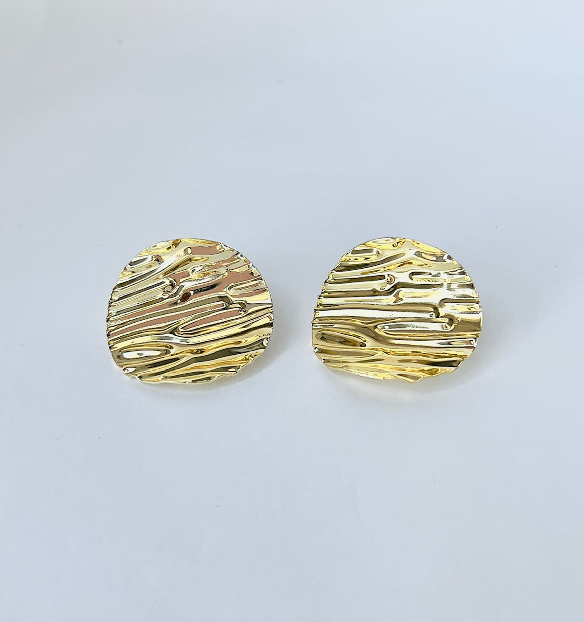Exquisitely crafted, these large corrugated earrings are gold plated and perfect for women seeking unique, elegant jewelry