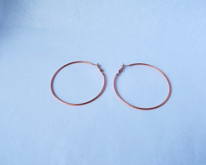 Style them up! Pink Hoop Earrings with other accessories for a totally on-trend look.