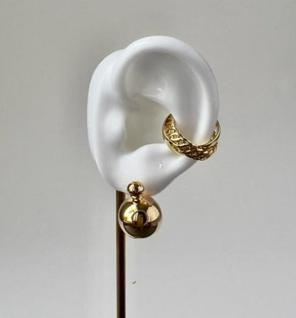 bubble gold earring for women in a white silicon ear display